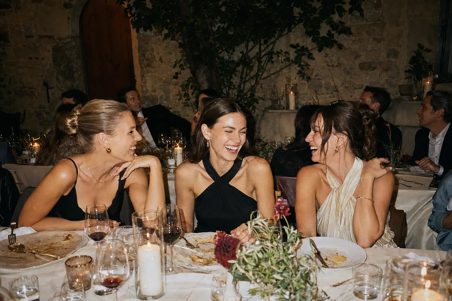 Friends talking around a dinner table